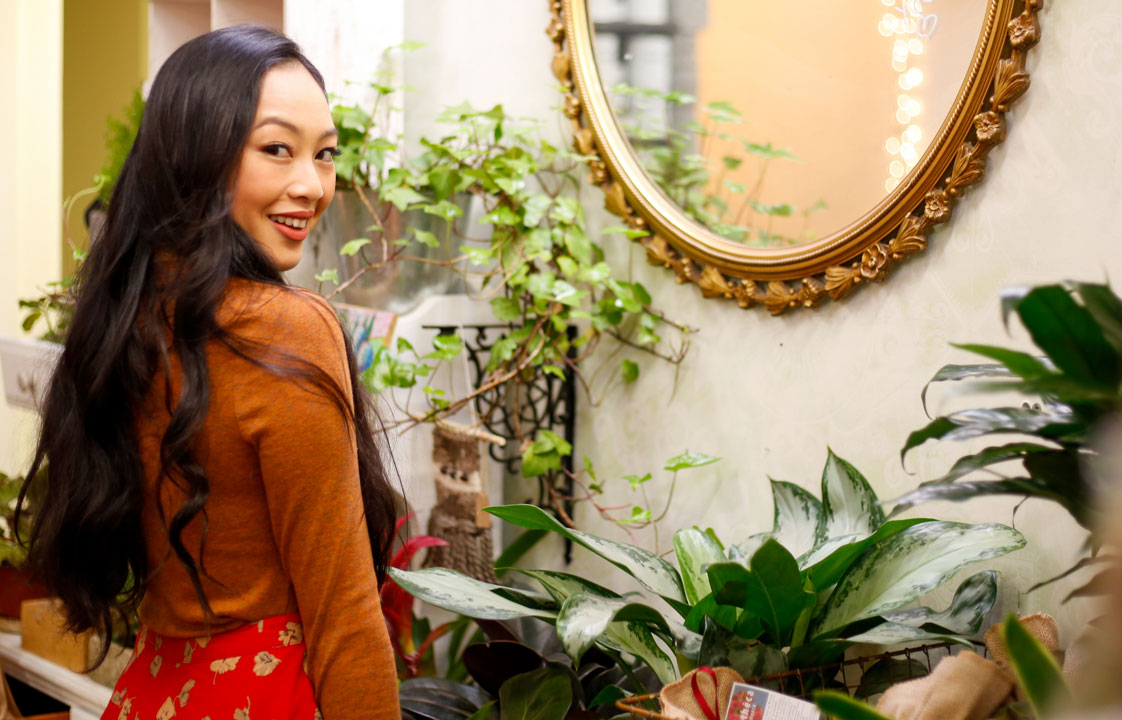 Woman Smiling in front of mirror